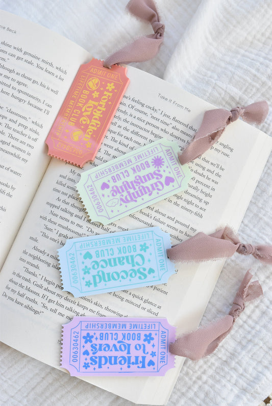 Colorful ticket-like bookmarks on an open book